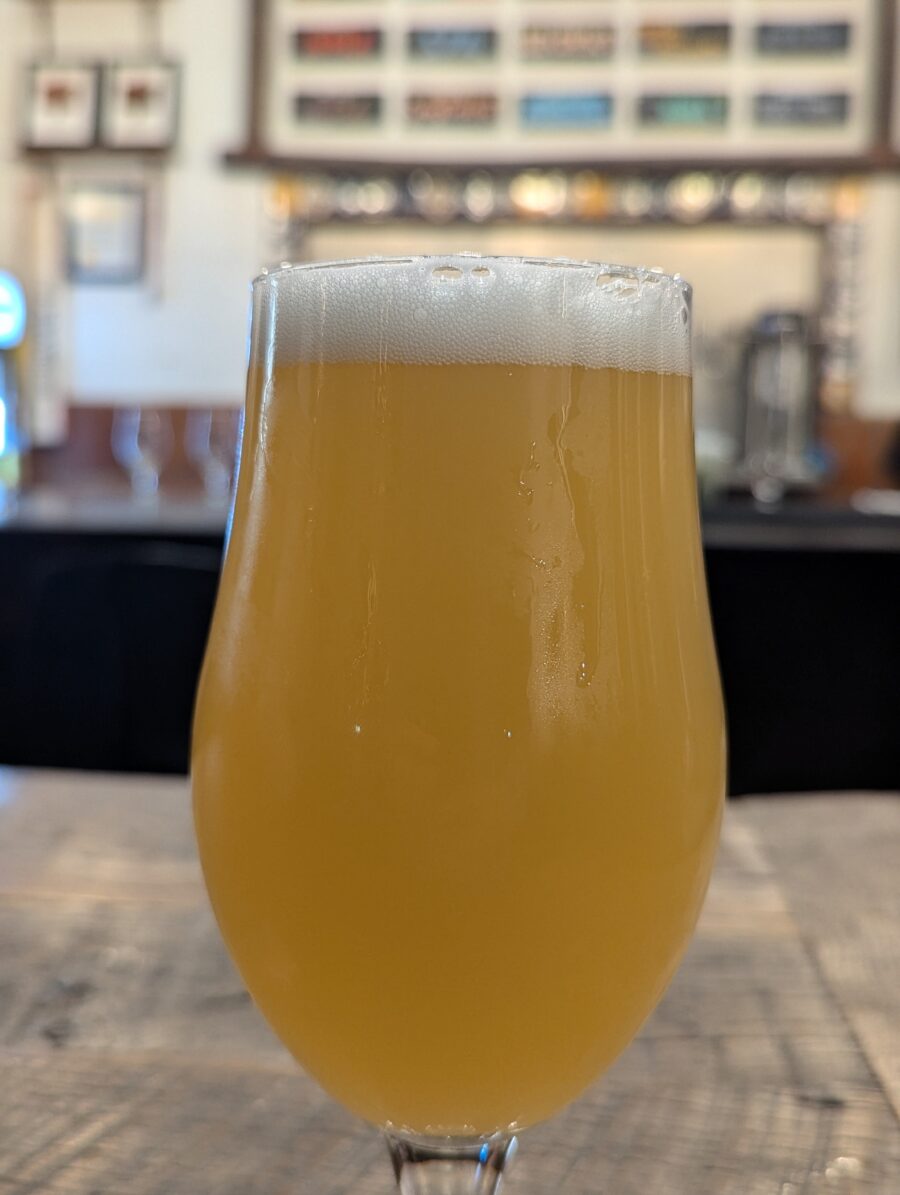 A frothy glass of hazy IPA.